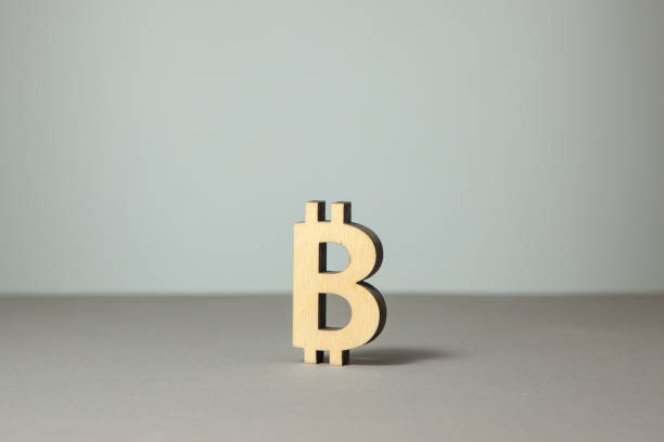 istock Symbols of bitcoin crypto-currency on a gray 1008340504