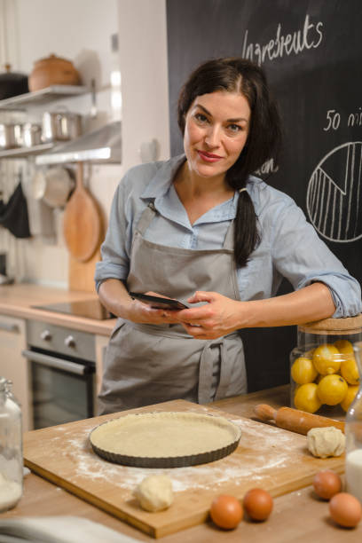 istock Woman preparingsweet pie in her kitchen 1008340934