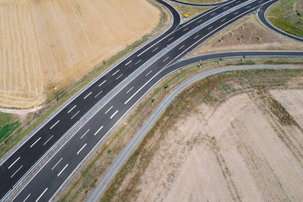 istock Road through agricultural area, aerial view 1008353856