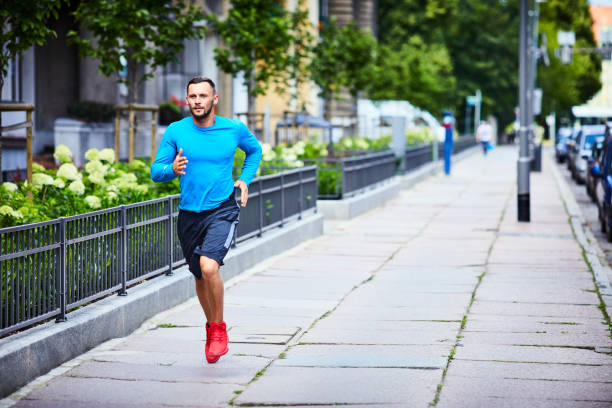 istock Handsome man running in the city 1008354446