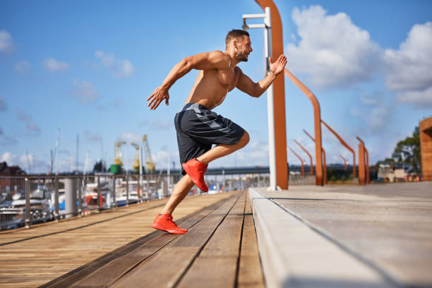 man doing hit exercises on stairs outdoors - shirtless energy action effort imagens e fotografias de stock