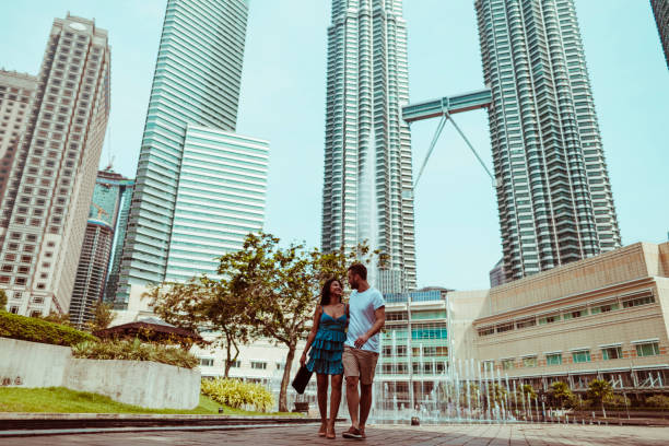 istock Young couple walking in public park 1008363234