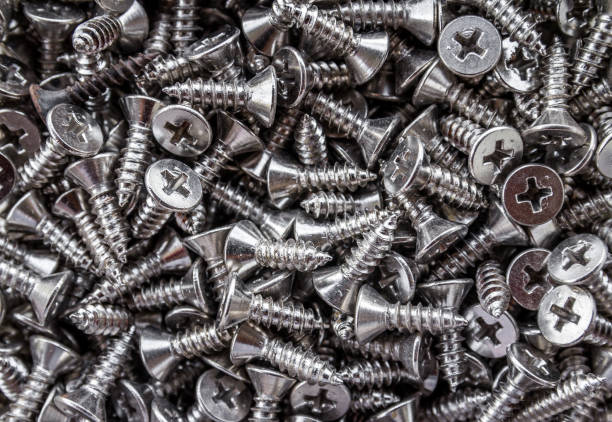 istock Closeup of steel screws background 1008366308