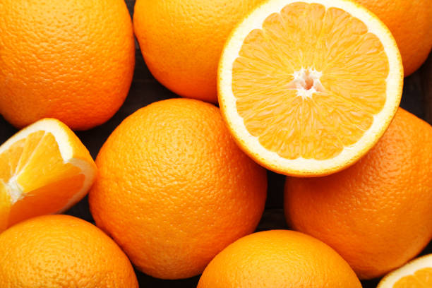 istock Ripe and sweet orange fruit background 1008371984
