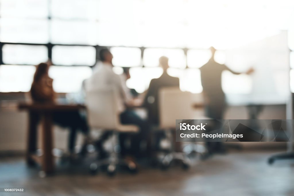 Making success happen Shot of businesspeople having a meeting in an office Defocused Stock Photo