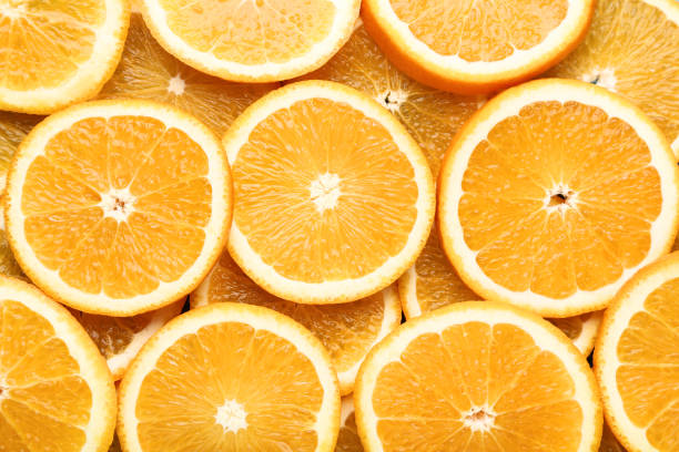 istock Sliced of orange fruit background 1008375608