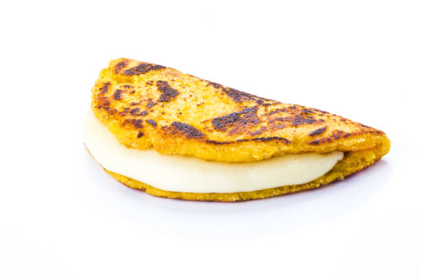 istock Cachapa with cheese, Typical Venezuelan cuisine made of ground corn and white cheese, white background 1008383048