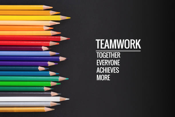 istock Teamwork concept. group of color pencil on black background with word Teamwork, Together, Everyone, Achieves and More 1008383436