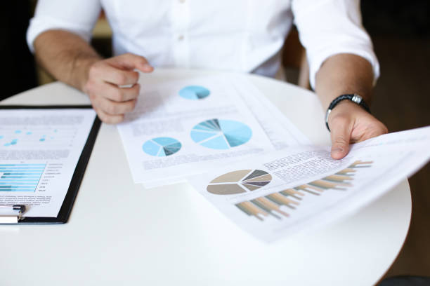 istock Male person working with documents and diagrams 1008393172