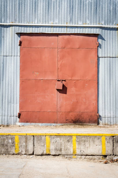 istock Old metal warehouse door, hangar gate 1008401840