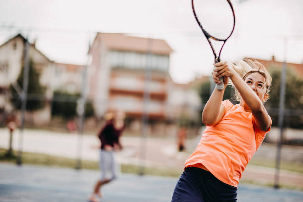 istock Womens doubles match tennis volley 1008401896