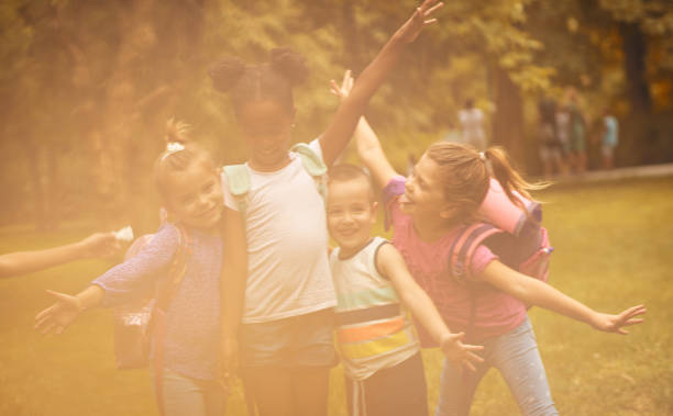 istock Group of children poses to camera. 1008404976
