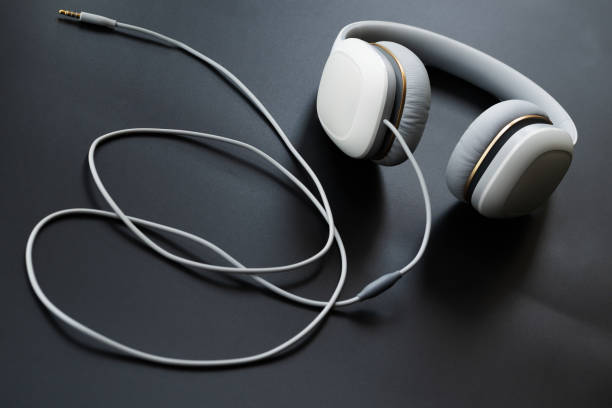 istock Headphones white isolated on a black background 1008405504