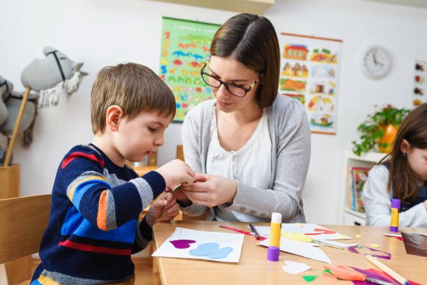 istock Preschool Teacher with Children at Kindergarten - Creative Art Class 1008412928