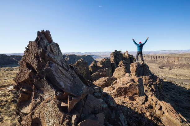 istock Man on top of Mountain 1008413188