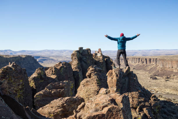 istock Man on top of Mountain 1008413196