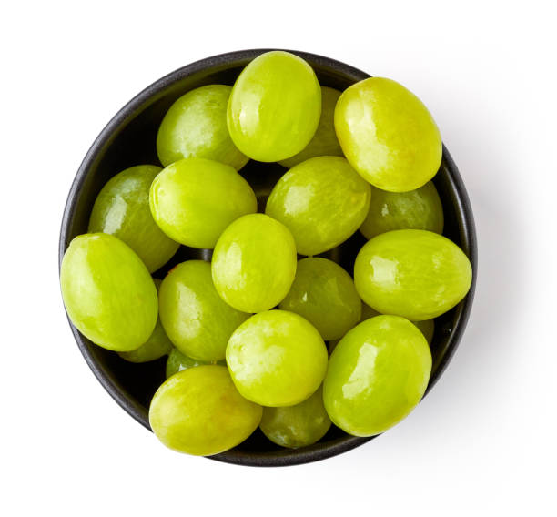 istock Bowl of white grapes isolated on white, from above 1008419348