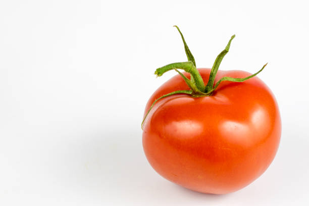 Fresh ripe red tomato organic vegetable isolated on white.