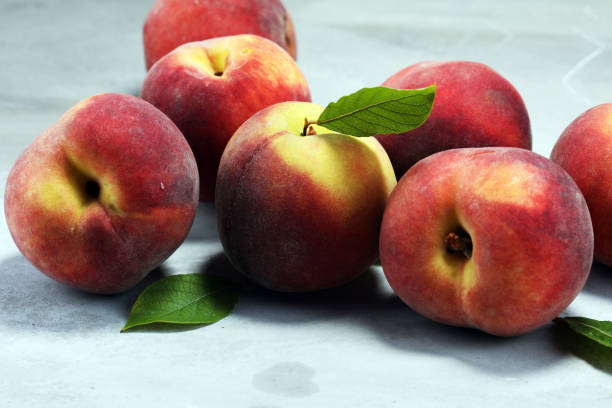 istock A group of ripe peaches on table 1008439762