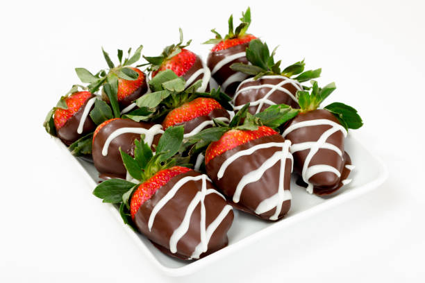 istock Chocolate dipped strawberries drizzled with white chocolate. 1008443394