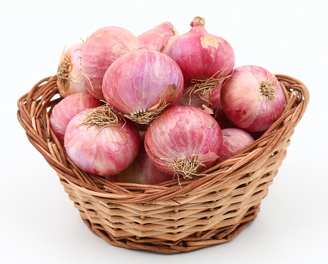 Close-up of fresh red onions isolate on white