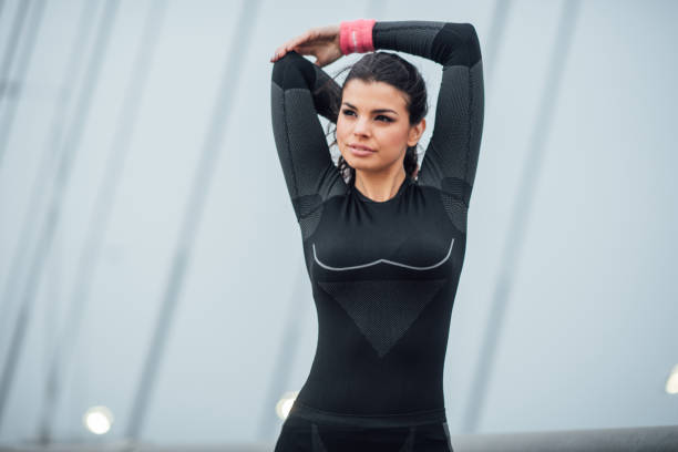 istock Female jogger exercising on the bridge 1008443778