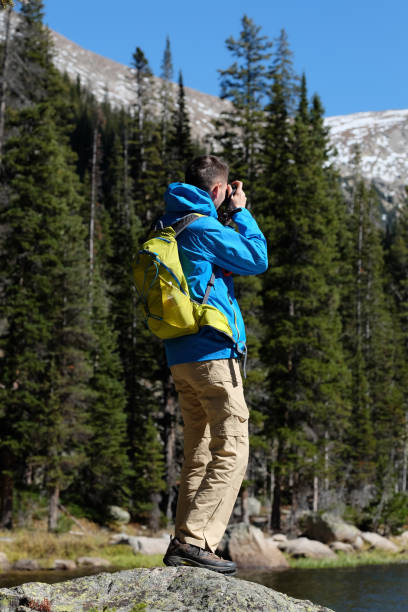 istock Backpacker hiker tourist taking photo 1008450290