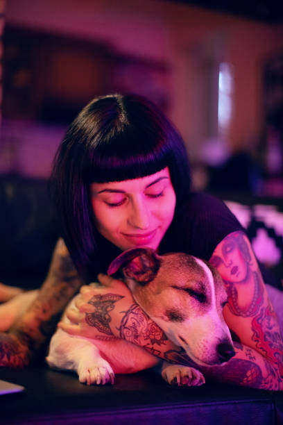 istock Beautiful young woman with dog 1008450980