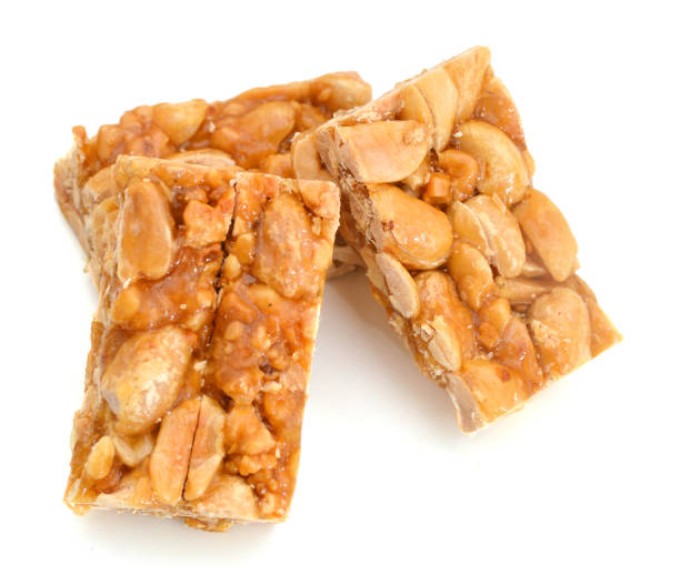 istock peanut in a sugar syrup (caramel) on a white background 1008454738