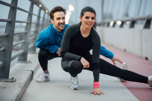 istock Happy couple exercising on the bridge 1008458602