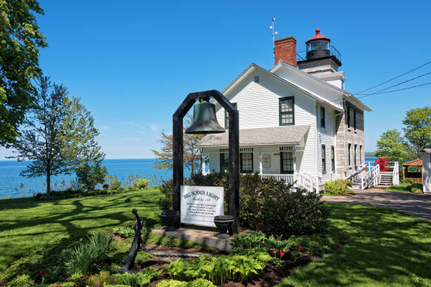 Sodus Point Lighthouse and Museum Sodus Point, NY - May 21, 2018: Sodus Point Lighthouse and Museum in Sodus Point New York On Lake Ontario rochester new york state stock pictures, royalty-free photos & images