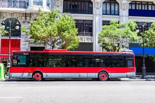 Photo of Red city bus with copy space