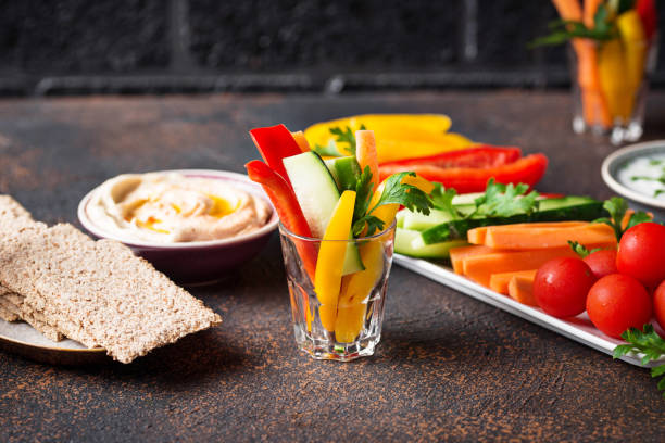 istock Healthy snacks. Vegetables and hummus 1008475156