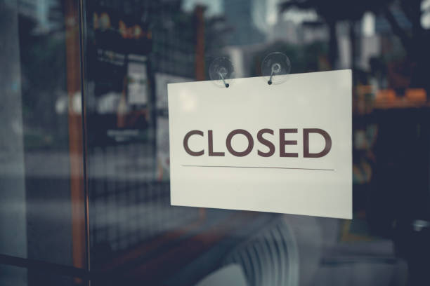 istock Closed sign on a glass door 1008477996