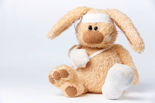 Cute sick bandaged hare Cute sick bandaged hare on a white background. broken toy stock pictures, royalty-free photos & images