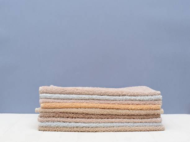 istock A stack of colorful towels on a grey background isolation.Closeup. Scandinavian style 1008488338