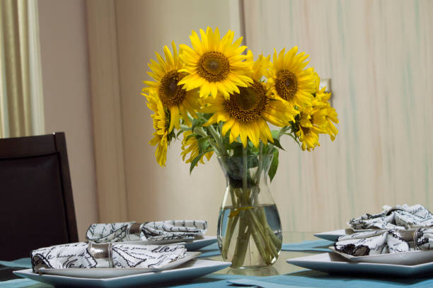 istock The beautiful sunflowers in a vase on the dining room table 1008490364
