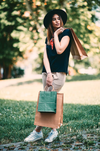 istock Woman standing in park. 1008492268
