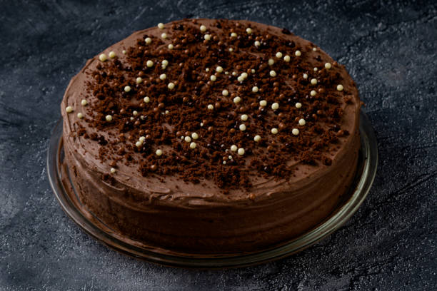 istock Sweet dark brown chocolate cake with decoration 1008495364