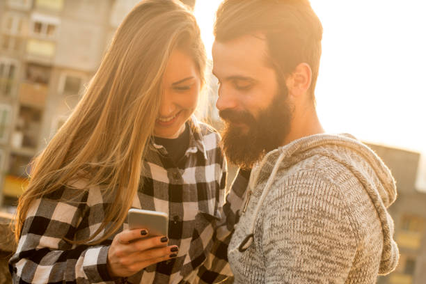 istock Couple or friends with a smart phone 1008509214