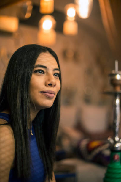 istock Middle Eastern woman in a bar 1008524860