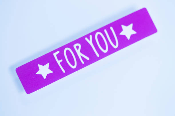 For you greetings message written in letters on presenta tag.