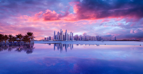 istock Skyline of Dubai Marina at a beautiful sunset with an infinity pool in front 1008539598