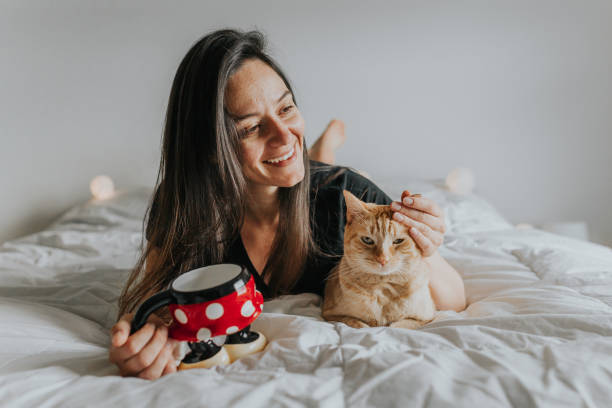 istock Woman in Bed with Cat 1008540762