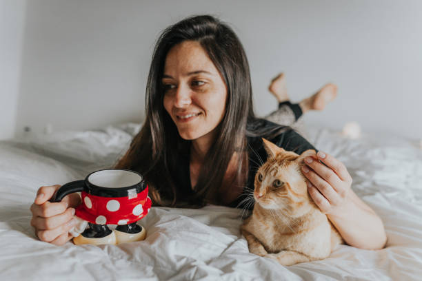 istock Woman in Bed with Cat 1008540798