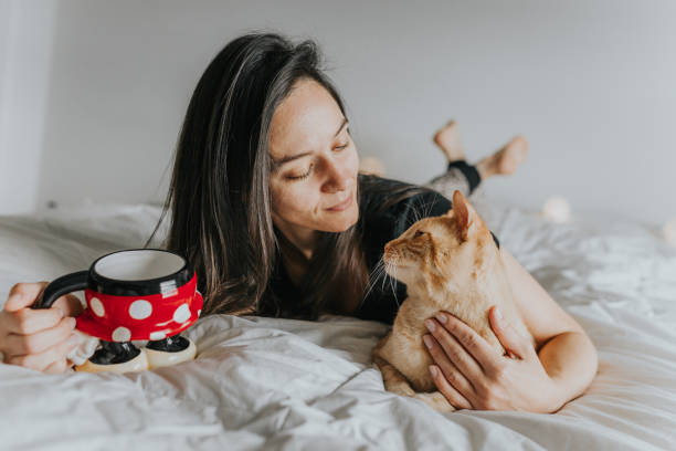 istock Woman in Bed with Cat 1008540836