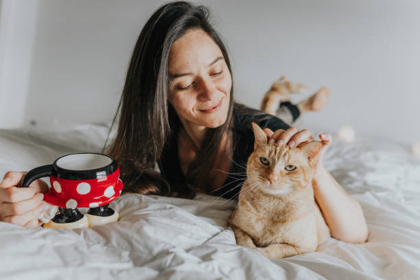 istock Woman in Bed with Cat 1008540868