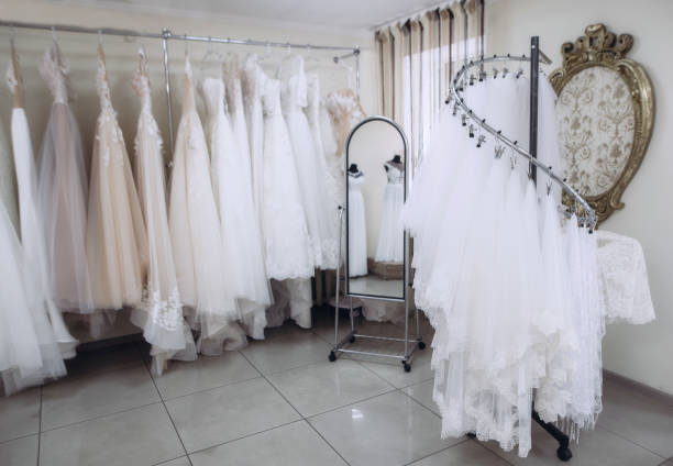 istock Many beautiful wedding dresses hang in the store 1008550530