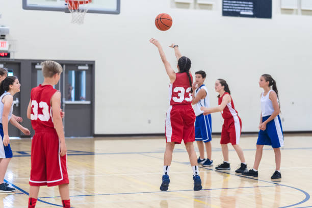 istock Co-ed high school basketball 1008556954