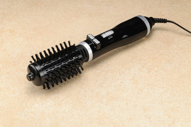 istock Black brush hair dryer on the marble background with copy space 1008560904